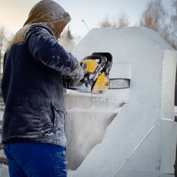 Chainsaw work. Craftsmen make ice sculptures.