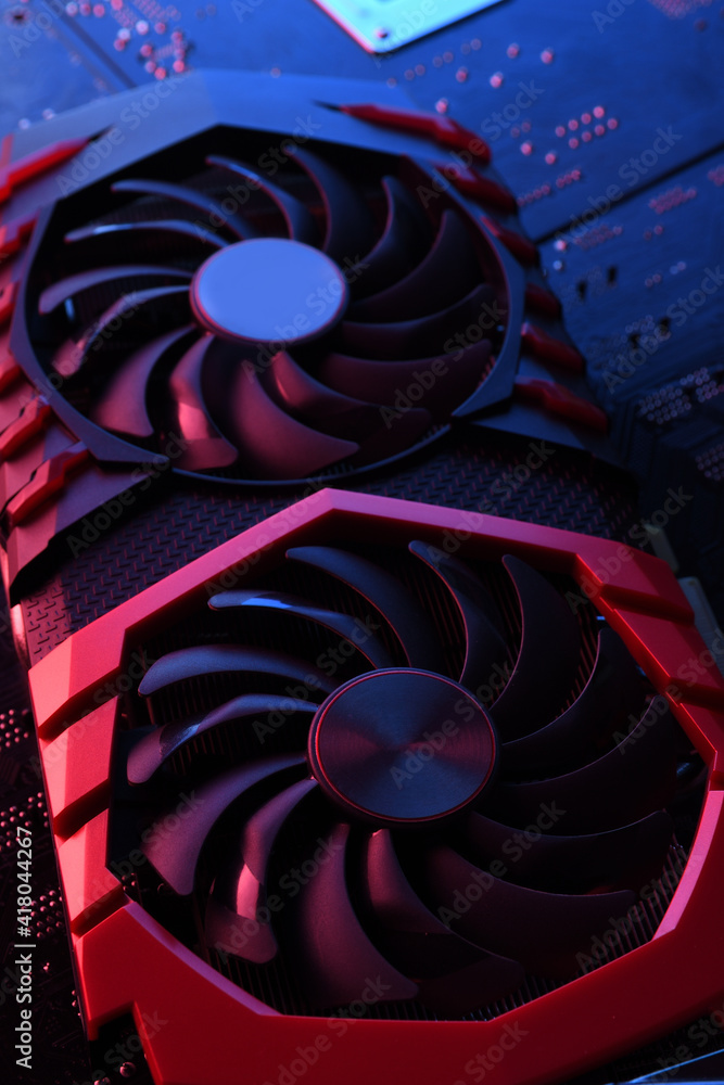 Poster computer game graphics card, videocard with two coolers on circuit board ,motherboard background. cl