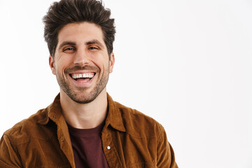 Happy handsome young man smiling and looking at camera