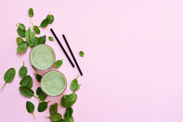 Smoothie with spinach on a pink background. Advertising. Detox drink. The keto diet.