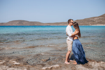 Happy Couple hugging at the sea beach, adult, summer holidays