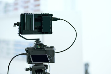 Dslr camera with additional screen for video shooting .