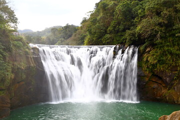 Fototapeta na wymiar Shifen Waterfall, a waterfall located in Pingxi District, New Taipei City, Taiwan