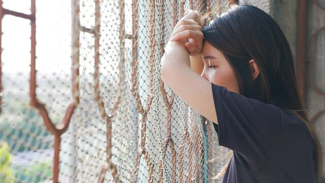Portrait of Depressed Asian woman concept of Mental health, imprisonment Human trafficking and broken married