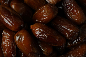 Tasty dates fruits on whole background, close up