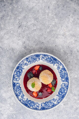 Sweet dumplings with berry sauce and fresh berries