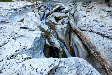 White cliffs and mountain crystal clear, shallow river in a wild place in the mountains in summer in a dense forest in summer