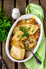 Homemade potato gratin with ground beef, cheese and garlic