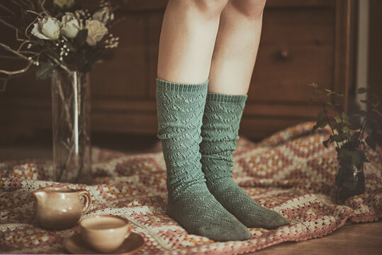 Close-up of a Woman in long socks standing on a blanket