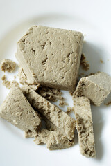 traditional eastern sweets, sunflower seed halva on white plate
