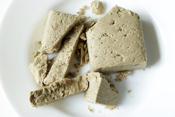 traditional eastern sweets, sunflower seed halva on white plate