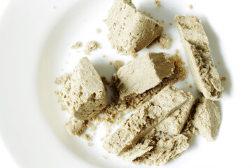 sweet sunflower halva on white dish top view