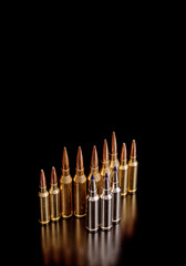 Bullet isolated on black background with reflexion. Rifle bullets close-up on black back. Cartridges for rifle and carbine on a black.