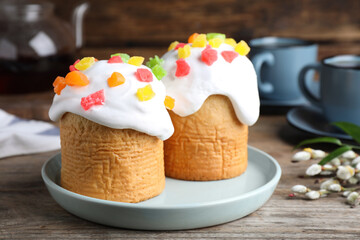 Beautiful decorated Easter cakes on wooden table