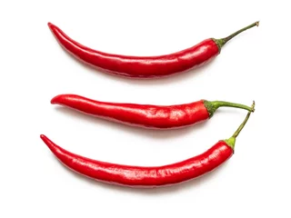 Fotobehang Three pods of red hot chili pepper with green cuttings © roundex