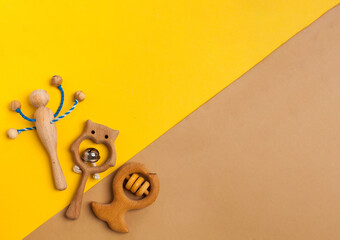Children's wooden toys, rattles and teethers. Copy space.