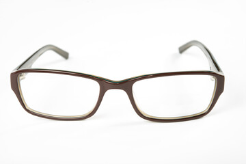 Eyeglasses with brown rim on white background