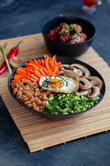 Korean national pilaf bibinpap on dark background