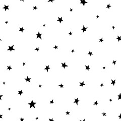 Seamless abstract pattern with black hand drawn shabby stars of different size on white background.
