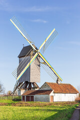 Fototapeta na wymiar View of the protected windmill called 't Meuleken in Zingem, a village in the Flemish Ardennes
