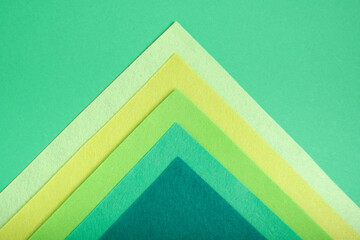 textured geometric background of felt several shades of green, mock up