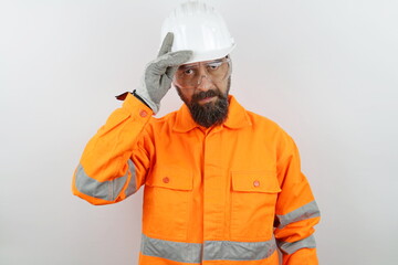 Portrait handsome bearded man wearing reflecting jacket and hardhat 