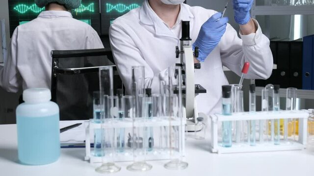 Scientists are researching for Covid19 vaccine in a laboratory. Doctors are testing  a new phamaceutical.