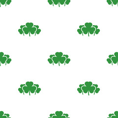 Seamless shamrock background with green clover leaves on white background.