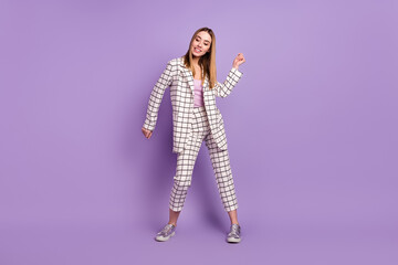 Full size photo of optimistic blond hair lady dance wear suit isolated on violet color background