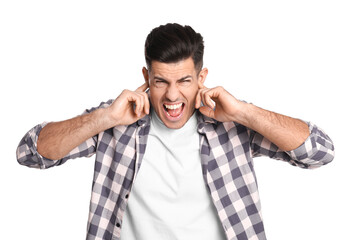 Emotional man covering ears with fingers on white background