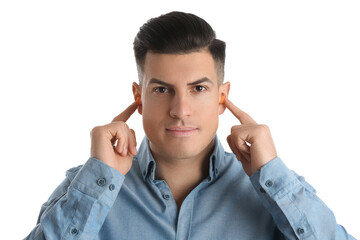 Man inserting foam ear plugs on white background