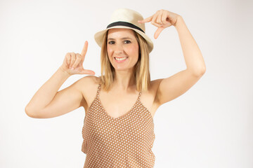 Happy woman making frame with fingers isolated over white background