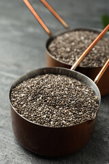 Saucepan with chia seeds on slate table