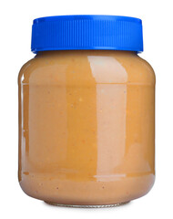 Delicious peanut butter in glass jar isolated on white