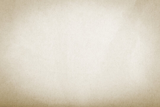 Rough-textured beige paper used as wallpaper or background with copy space