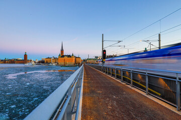 Fototapeta premium Stockholm, Sweden Riddarholmen island and a pedestrian and train bridge.