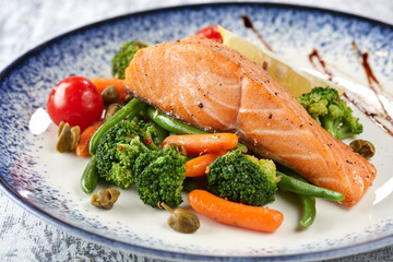 salmon steak with roasted vegetables