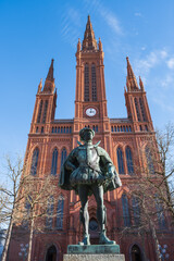 View to the market church in Wiesbaden / Germany with a statue in front of it 
