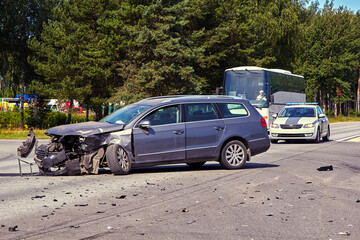 Obraz na płótnie Canvas Damaged front side of car after accident on a road