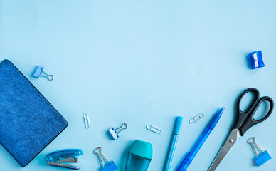 Blue stationery set. Office tools. Back to school, learning concept. With copy space
