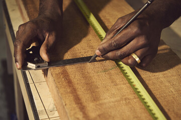 carpenter measuring wood