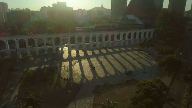 Long sunset shadows cast from the Carioca Aqueduct known as the iconic Lapa Arches (Arcos da Lapa) in Rio de Janeiro Brazil