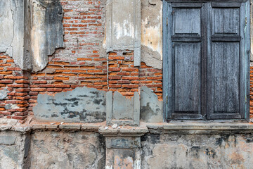 Blue windows with the red brick wall