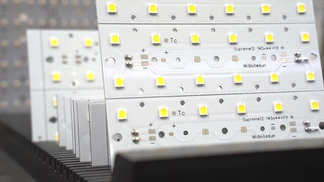 Different size LED-panels stacked in a row on display.