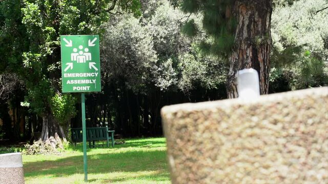 Emergency Assembly Point sign at Zoo, Panning shot right to left