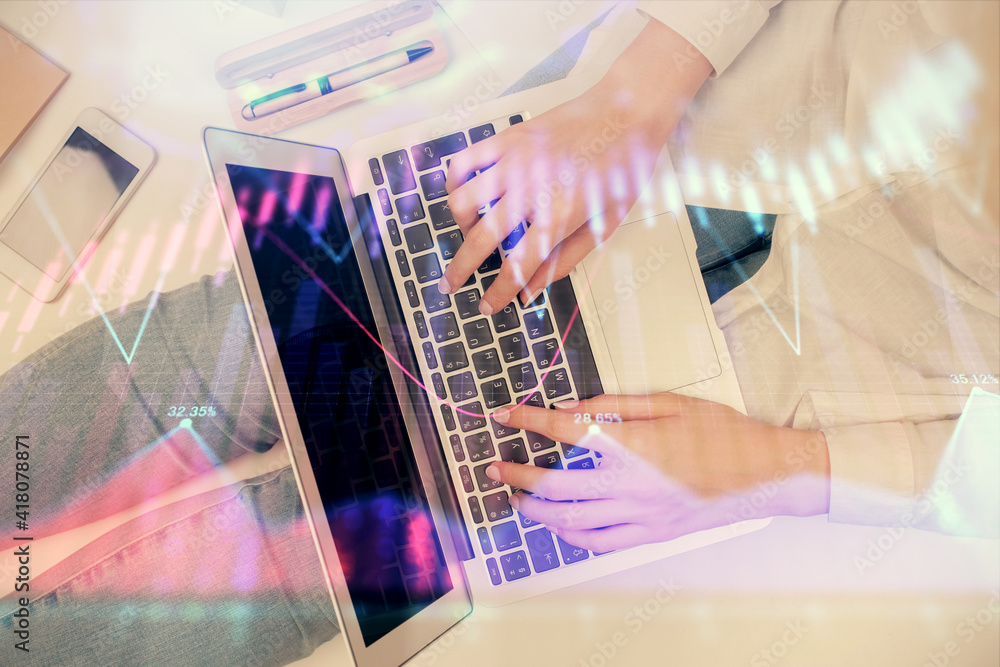 Poster double exposure of woman hands working on computer and forex graph hologram drawing. top view. finan