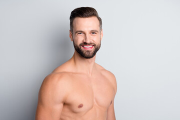 Fototapeta premium Photo of young handsome man happy positive smile pure fresh skin after shower isolated over grey color background