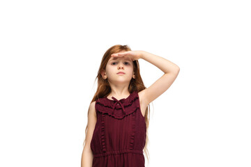 Fototapeta premium Looking forward. Happy, smiley little caucasian girl isolated on white studio background with copyspace for ad. Looks happy, cheerful. Childhood, education, human emotions, facial expression concept.