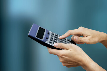 closeup shot of hands Press calculator 