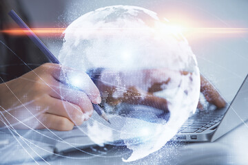 Multi exposure of woman hands typing on computer and business theme hologram drawing. Success...